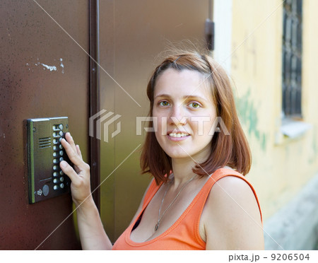 woman uses intercom 9206504