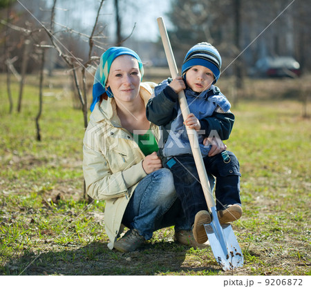 woman and boy with spade woman and boy with spade 9206872
