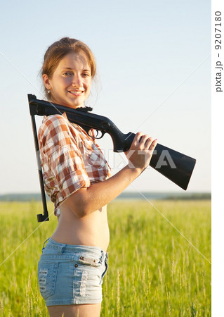 Girl with pneumatic air rifle 9207180