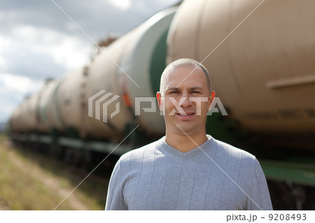 worker near oil cistern car worker near oil cistern car 9208493