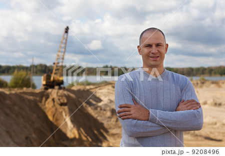 worker at sand pit worker at sand pit 9208496