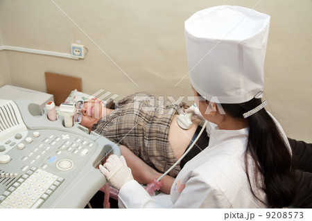 Doctor working with ultrasonic medical device Doctor working with ultrasonic medical device 9208573