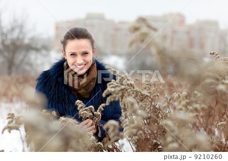 smiling gir at wintry park 9210260