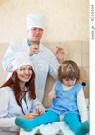 Doctors working with baby girl Doctors working with baby girl 9210304