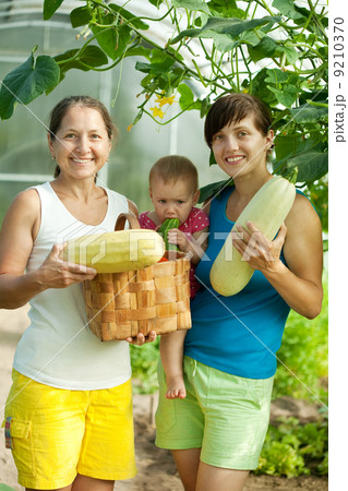 family with harvested vegetables 9210370