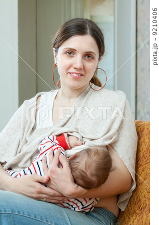 Nursing young baby 9210406