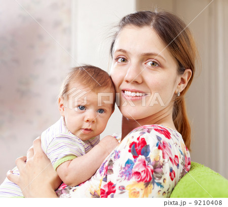 Portrait of happy mother with her baby Portrait of happy mother with her baby 9210408