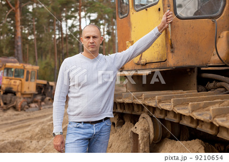 Tractor operator at workplace 9210654