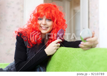 Woman in red wig Woman in red wig 9210789