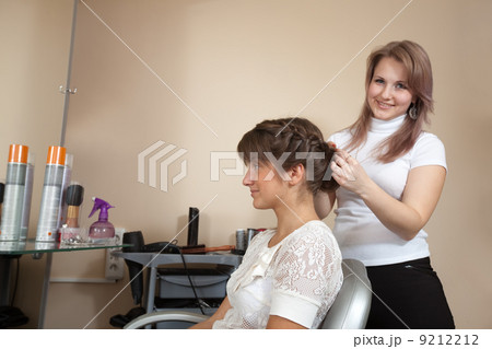 Female stylist working with long-haired girl 9212212
