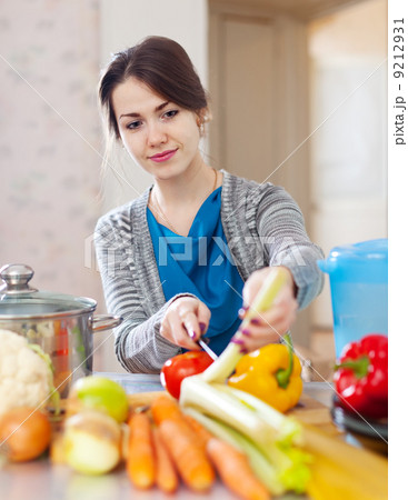 woman with celery anf other vegetables woman with celery anf other vegetables 9212931