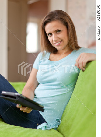 woman reads e-reader woman reads e-reader 9213000