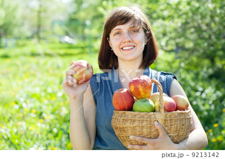 Happy woman with apple harvest 9213142