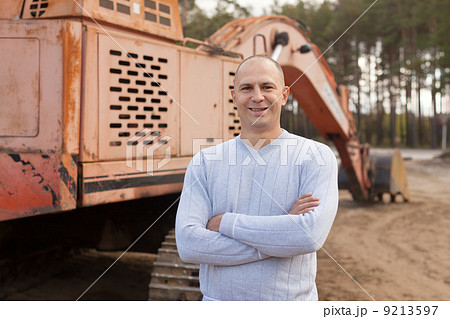 tractor operator at workplace 9213597
