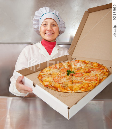 female cook with pizza 9213969