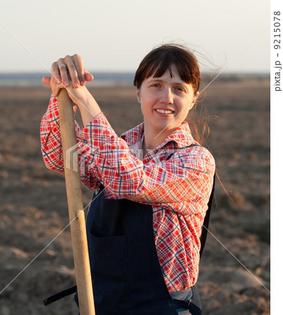 farmer in plowed field 9215078