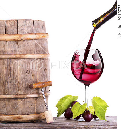 Red wine, glass and barrel with grapes Red wine, glass and barrel with grapes 9216778