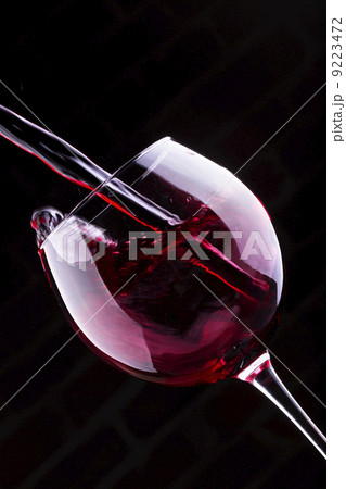 Splash red wine against a black background 9223472