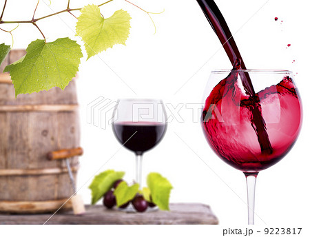Red wine, glass and barrel with grapes Red wine, glass and barrel with grapes 9223817