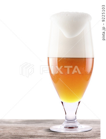 Frosty glass of light beer on a wooden table Frosty glass of light beer on a wooden table 9225103
