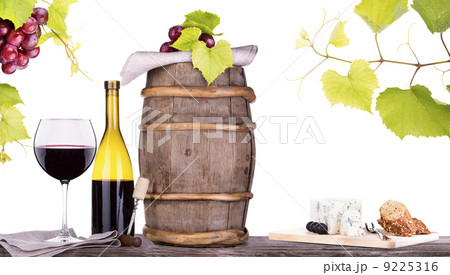 grapes on a barrel with corkscrew and wine glass 9225316