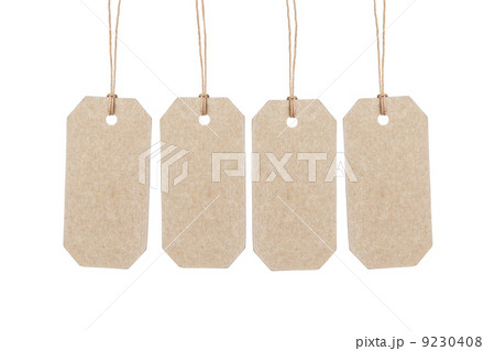 four brown tags hanging on ropes four brown tags hanging on ropes 9230408