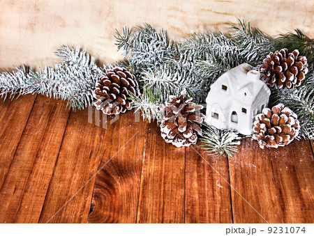 Christmas fir tree, house on wooden background Christmas fir tree, house on wooden background 9231074