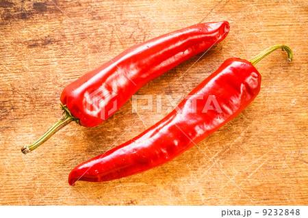 Red peppers on old wooden table Red peppers on old wooden table 9232848