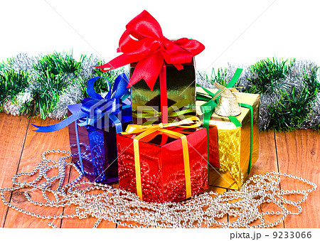 Christmas presents on a wooden background 9233066