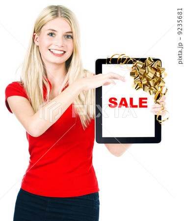 woman with tablet PC and gift ribbon bow decoration woman with tablet PC and gift ribbon bow decoration 9235681