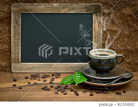 cup of coffee and vintage style blackboard 9235692