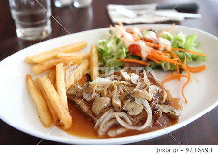 Grilled Porkchop with Potatoes and salad Grilled Porkchop with Potatoes and salad 9236693