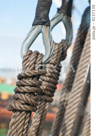 Ancient wooden sailboat pulleys and ropes detail Ancient wooden sailboat pulleys and ropes detail 9237130