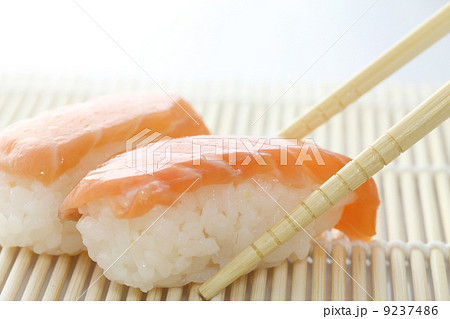 Salmon sushi with chopsticks 9237486