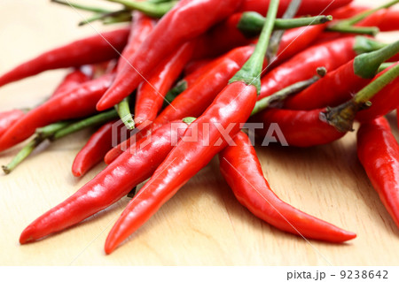 Red hot chili pepper on wood background 9238642