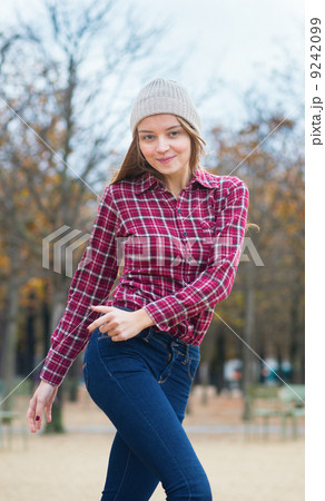 Cheerful young girl in a park 9242099