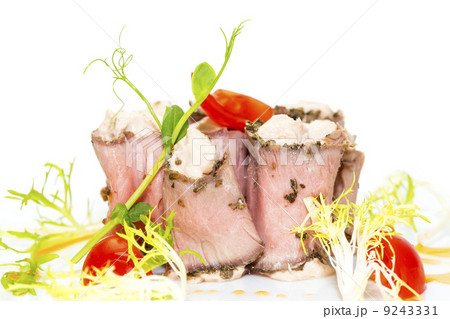 meat rolls with cheese decorated with tomato 9243331