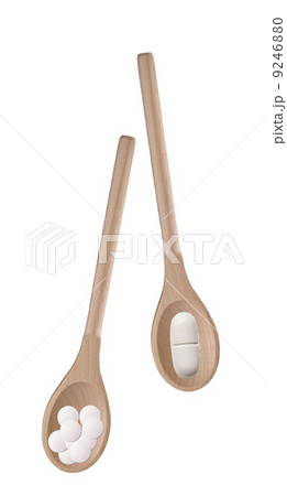 Tablets in a wooden spoones Tablets in a wooden spoones 9246880