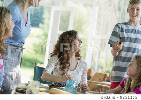 Farmhouse in the country in New York State. Four generations of women in a family baking cookies and apple pie. 9251155