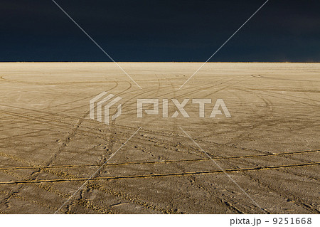 Tire tracks on the Bonneville Salt Flats. Speed Week. A dark stormy sky. Tire tracks on the Bonneville Salt Flats. Speed Week. A dark stormy sky. 9251668