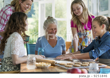 Farmhouse in the country in New York State. Four generations of women in a family baking together. Farmhouse in the country in New York State. Four generations of women in a family baking together. 9251846