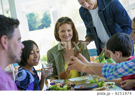 A family party around a table in a cafe. Adults and children. A family party around a table in a cafe. Adults and children. 9251974