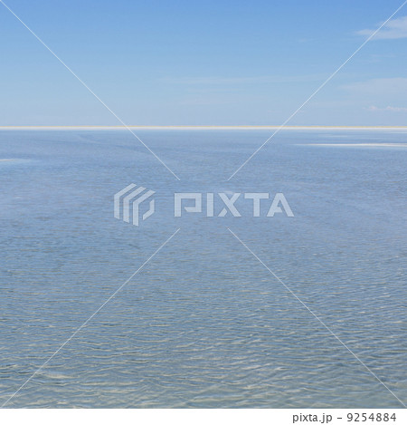 The View Across The Flooded Bonneville Salt Flats, At Dusk. Flat Landscape. A White Line Marking The Horizon. The View Across The Flooded Bonneville Salt Flats, At Dusk. Flat Landscape. A White Line Marking The Horizon. 9254884