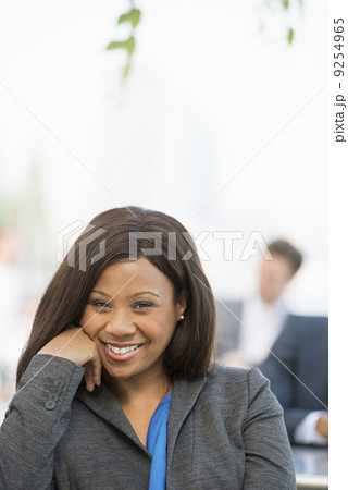 Summer. A Woman In A Grey Suit With A Bright Blue Shirt Smiling. Summer. A Woman In A Grey Suit With A Bright Blue Shirt Smiling. 9254965