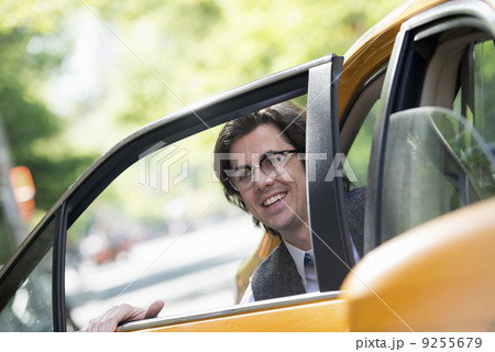City Life. People On The Move. A Young Man In The Back Seat Of A Taxi. 9255679