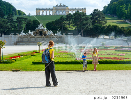 Family in summer city park. All another people are unrecognizabl 9255963