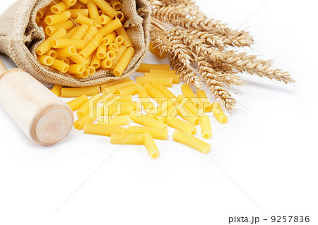 Pasta in a canvas bag and ear on white background. Pasta in a canvas bag and ear on white background. 9257836