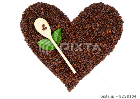 Heart made from coffee beans on white background. Heart made from coffee beans on white background. 9258104