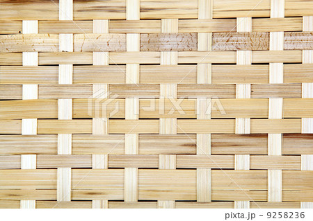 Wooden grid, the background of woven wood. Bamboo wood texture. Wooden grid, the background of woven wood. Bamboo wood texture. 9258236