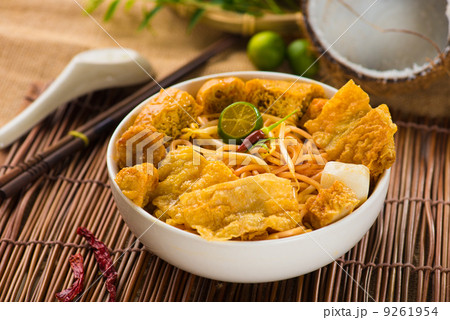 chopstick and laksa curry noodles with plenty of raw ingredients 9261954